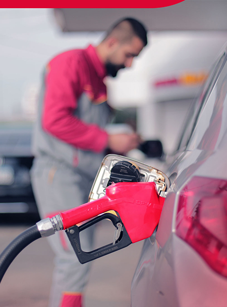 Image depicting a car refueling at an Amana Petroleum Company station, showcasing our reliable fueling services and commitment to customer satisfaction.